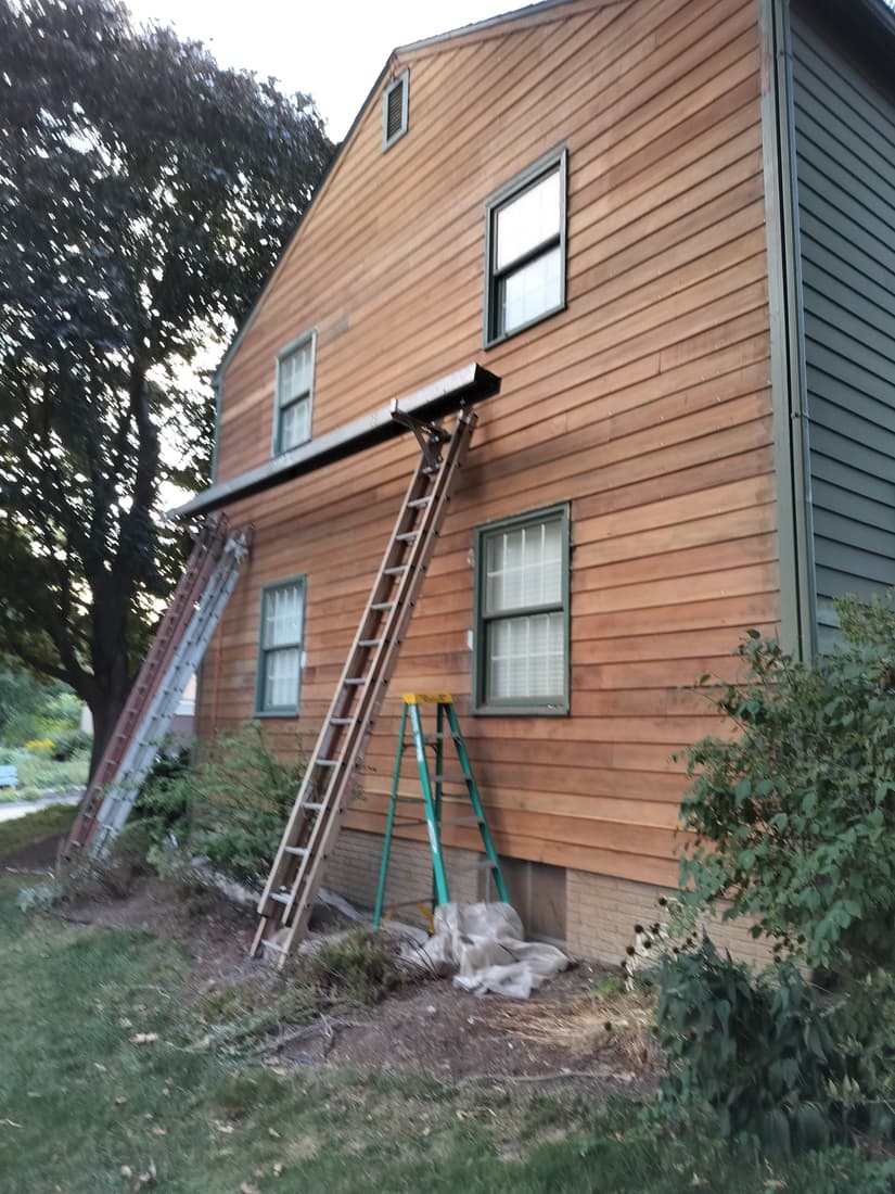 The south wall stripped in full, back to bare red heartwood.
