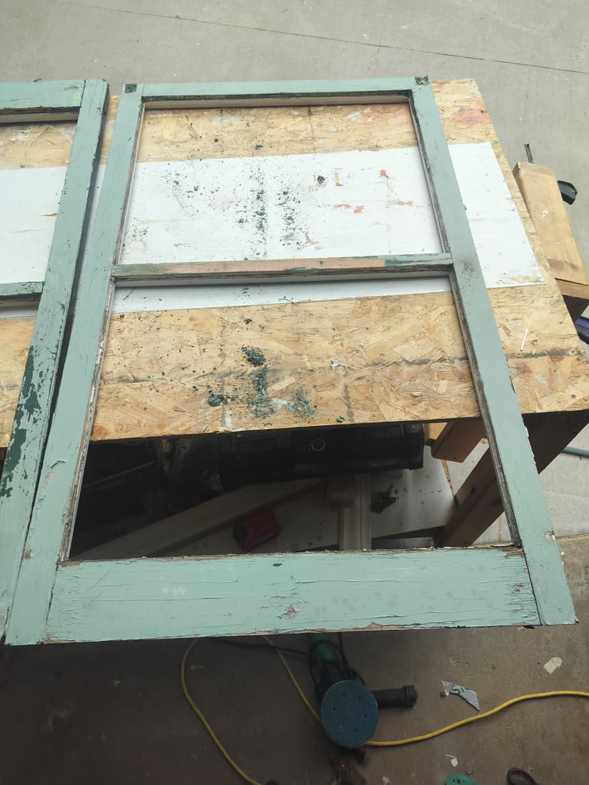 A back porch sash taken out and brought in to the bench.