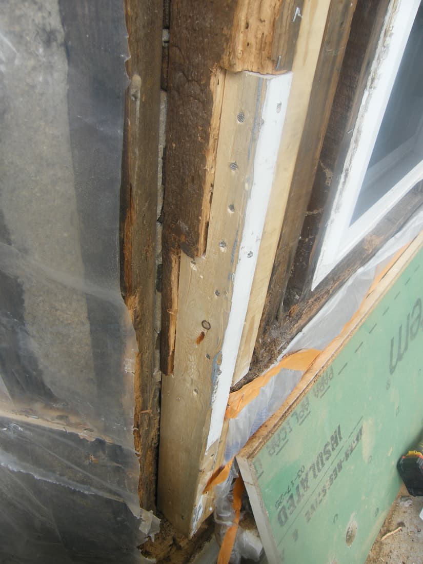 A new nailer fastened alongside the old framing at the bay.
