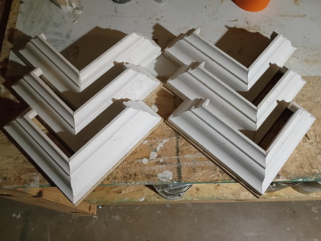 Colonial corner caps made up and mitred, ready to go on.