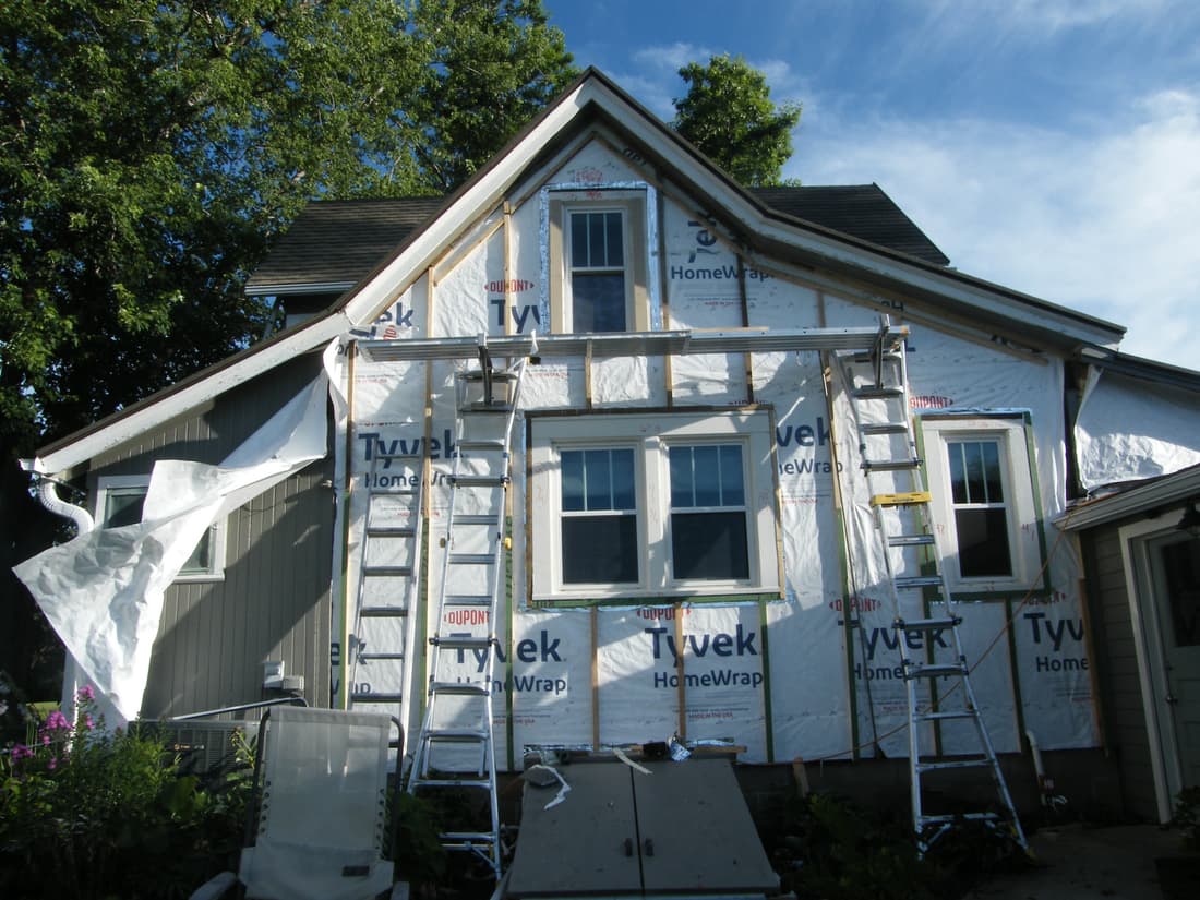 The north wall wrapped and furred out to bring the new siding to a flat plane.
