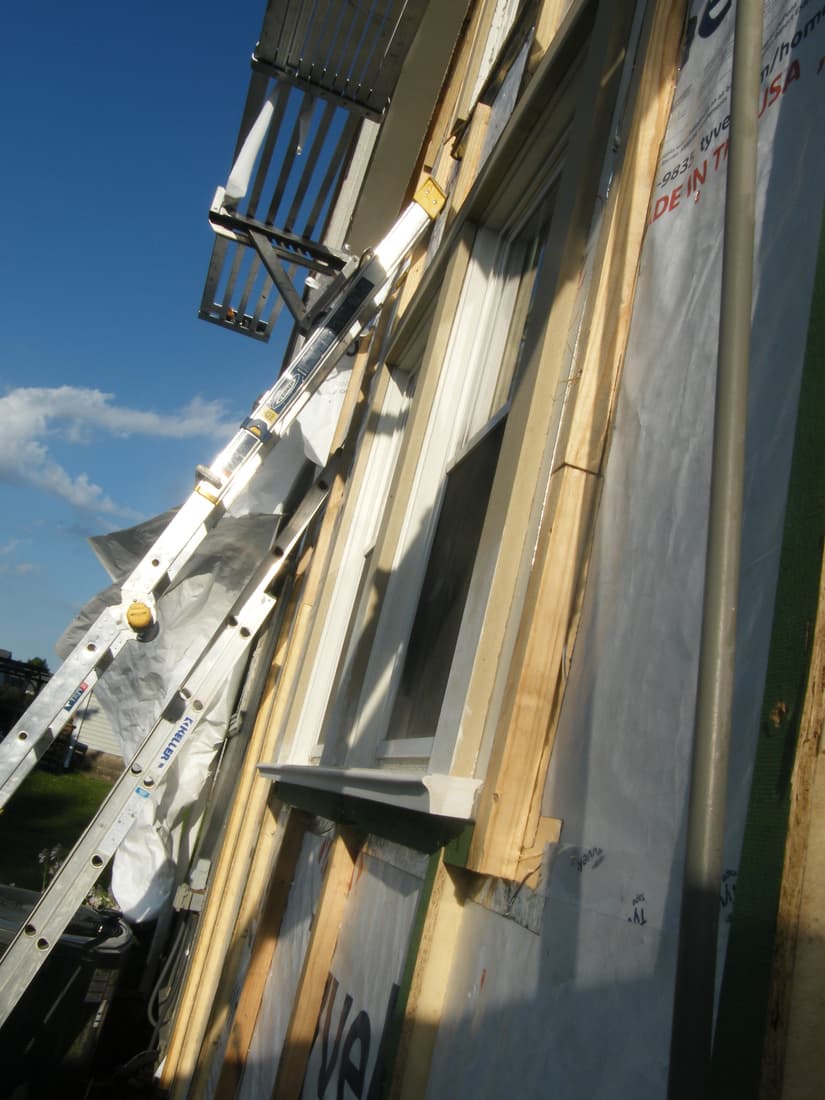 Furring over the wrap, with a new sill set under the window.