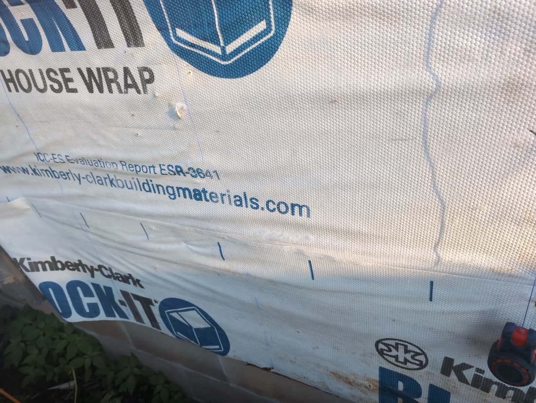Stud lines marked on the wrap before furring out the north wall.