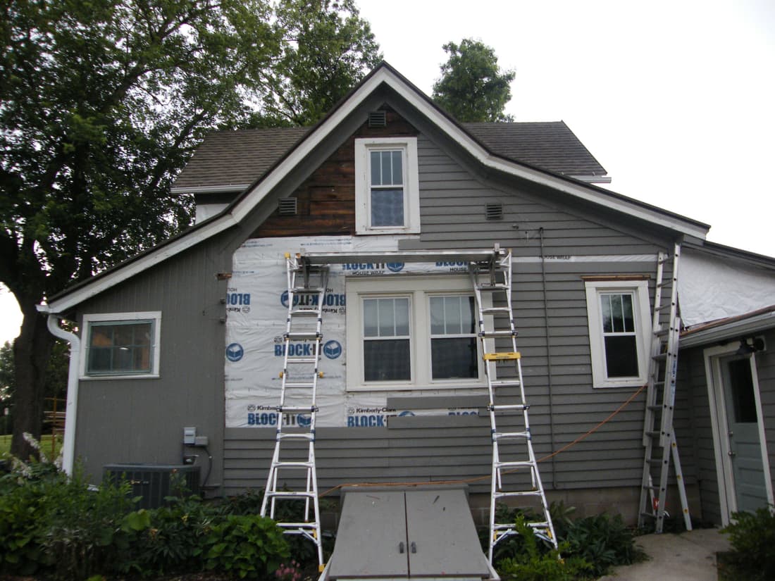 The north wall with the cedar off and house wrap going up over the sheathing.