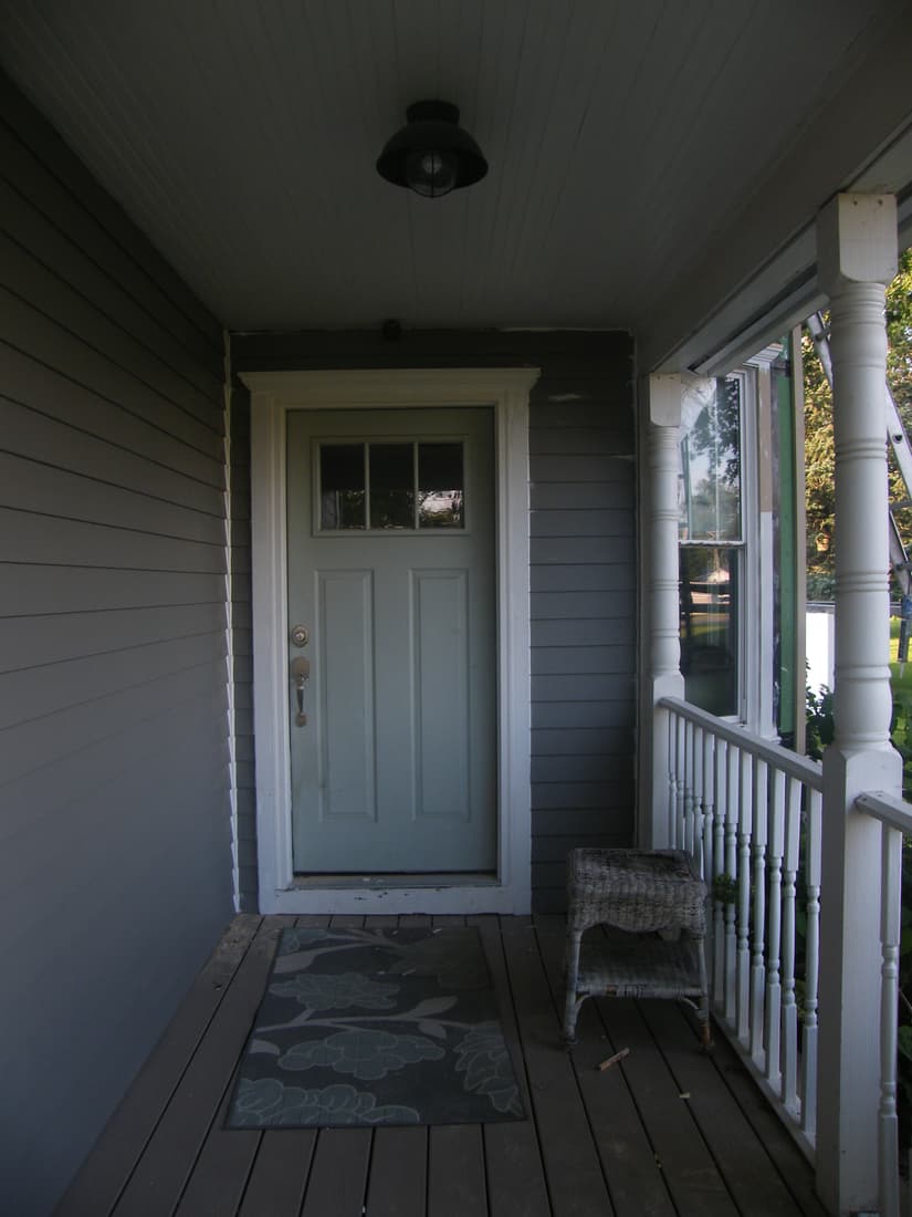 The porch sided and the door cased out.