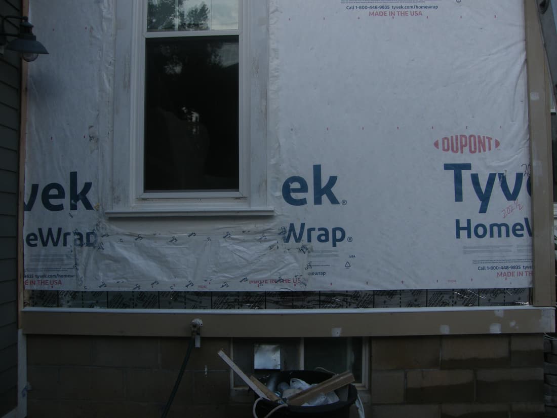 Window casing in, and the water table run along the base of the wall.