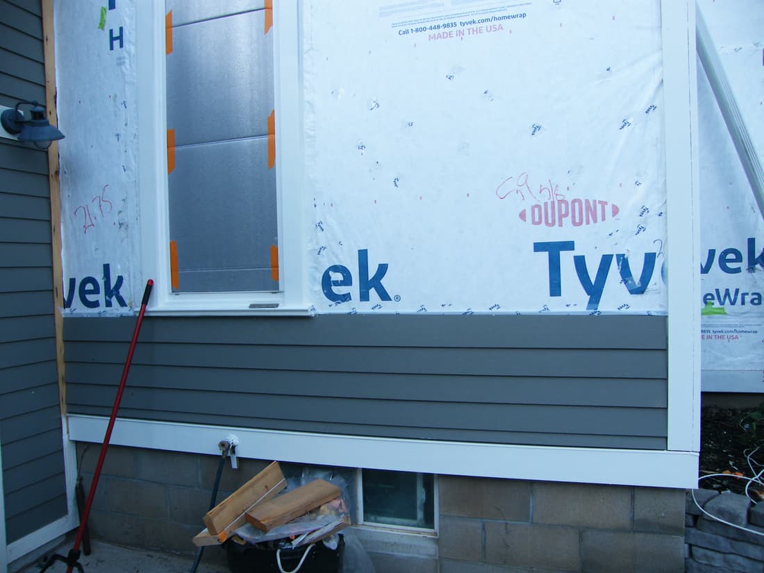 The first courses of SmartSide on the west wall.