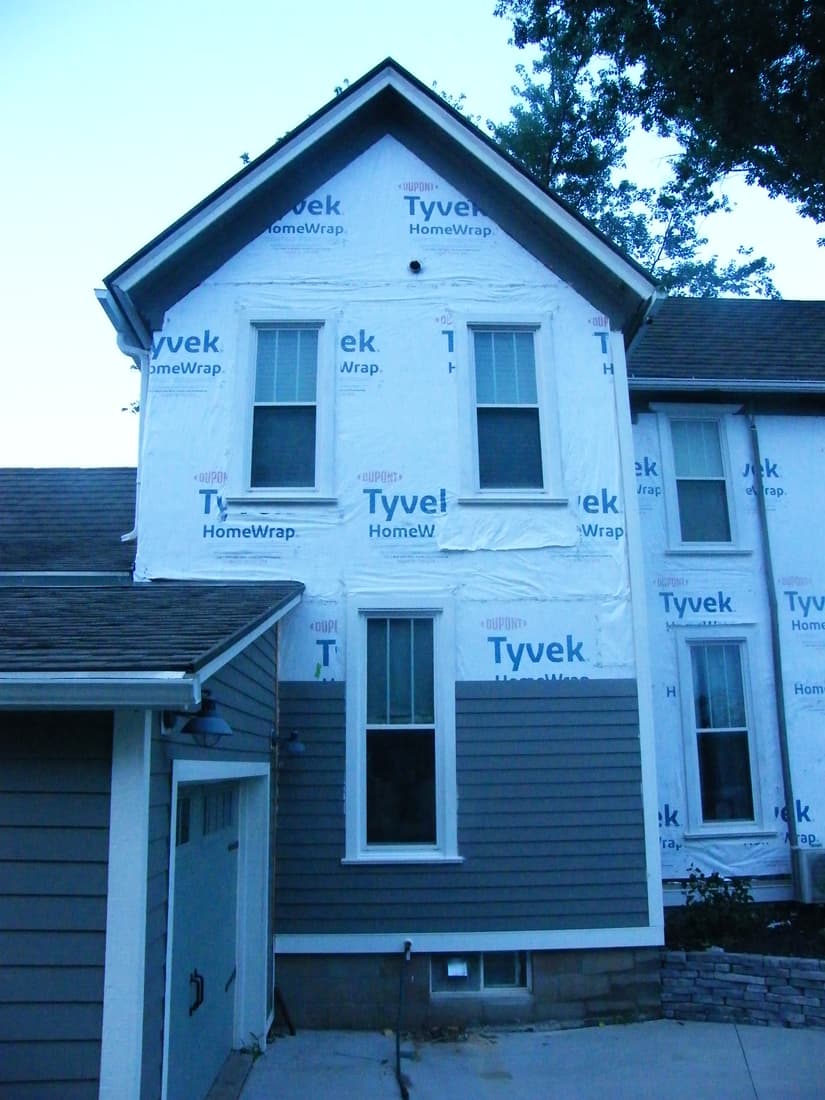 The west wall, siding up to the first floor line.