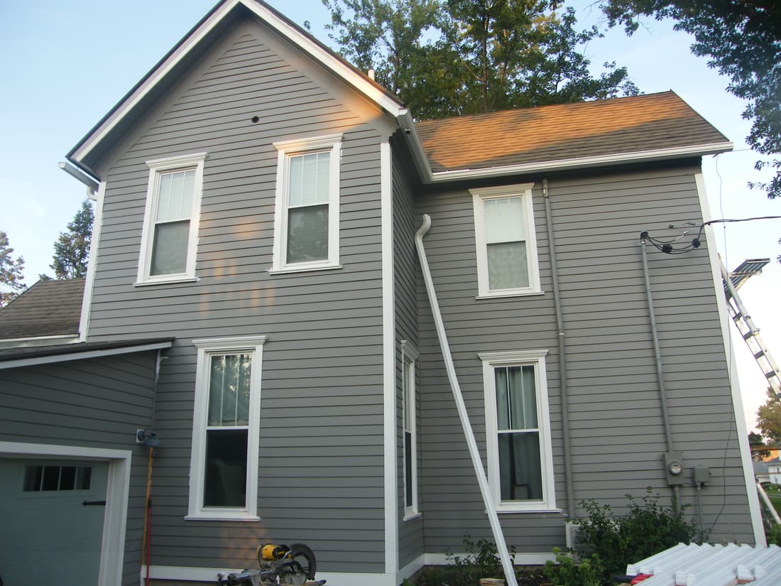Siding carried around the west and south corner.