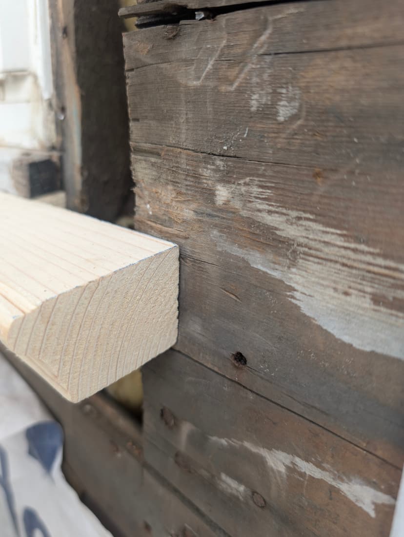 A new sill offered up to the opening for a first fit.