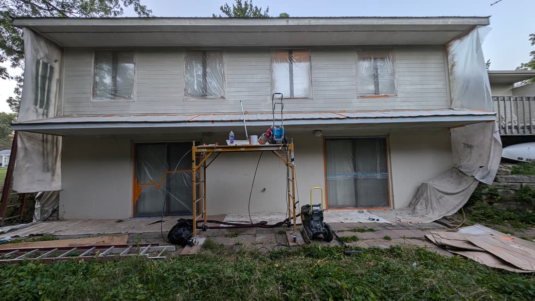 The south side masked off, with the sprayer set up.